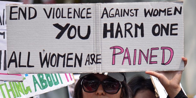 A woman holds a placard during a protest against the rape of an eight-year-old girl in Kathua, near Jammu, in Guwahati, India, April 21, 2018. REUTERS/Anuwar Hazarika