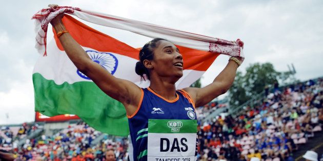 Athletics - 2018 IAAF World U20 Championships ? women's 400 metres ? Tampere, Finland ? July 12, 2018. Hima Das of India celebrates her victory. Lehtikuva/Kalle Parkkinen via REUTERS ATTENTION EDITORS - THIS IMAGE WAS PROVIDED BY A THIRD PARTY. NO THIRD PARTY SALES. NOT FOR USE BY REUTERS THIRD PARTY DISTRIBUTORS. FINLAND OUT. NO COMMERCIAL OR EDITORIAL SALES IN FINLAND.