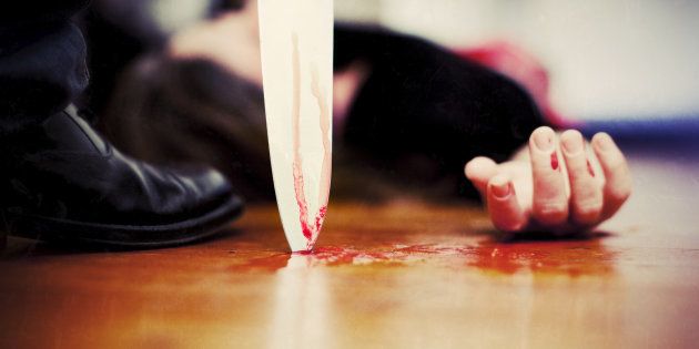 'Close up on a bloody knife planted on a wooden floor, a killing scene'