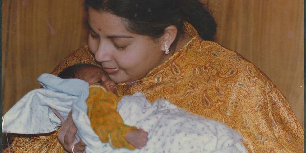 File Photo of AIADMK leader and Tamil Nadu Chief Minister J Jayalalithaa with an infant on May 19, 1995 in Chennai.