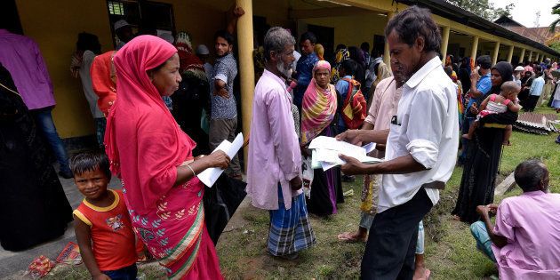 Villagers wait outside the National Register of Citizens (NRC) centre to get their documents verified by government officials, at Mayong Village in Morigaon district, in the northeastern state of Assam, India July 8, 2018.