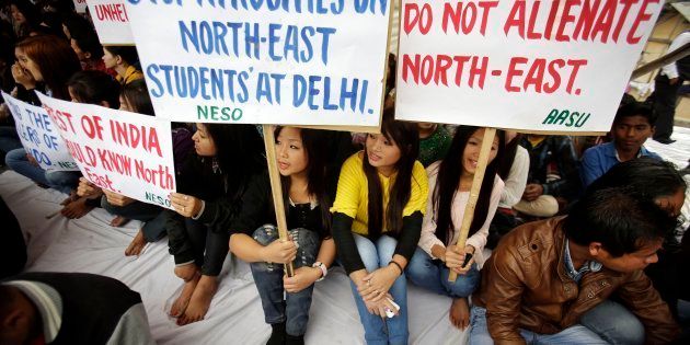 Members of North East Students Organization (NESO) hold placards as they participate in a protest in Gauhati.