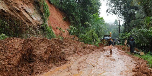 Indian rescuers conduct rescue operations after a landslide at Kuttampuzha village in Ernakulam district in the Indian state of Kerala on August 9, 2018.