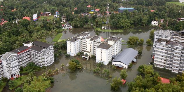 An aerial view shows partially submerged buildings at a flooded area in the southern state of Kerala, India, August 19, 2018. REUTERS/Sivaram V