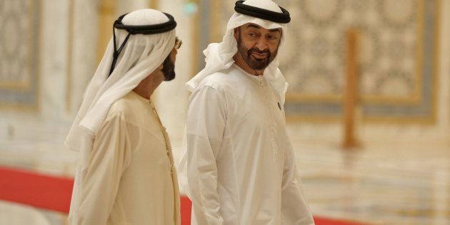 Abu Dhabi's Crown Prince Sheikh Mohammed bin Zayed Al Nahyan (R) walks with Dubai Ruler and Minister of Defence Sheikh Mohammed bin Rashid Al Maktoum, at the presidential palace in the UAE capital Abu Dhabi on July 20, 2018 during a reception for the Chinese president.