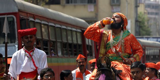A rally was organised on the occasion of the Chhatrapati Shivaji Maharaj Jayanti at Prateeksha Nagar by Shiv Sena - The man dressed as Shivaji Maharaj takes a sip to take breather from the heat.