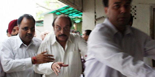 File photo of businessman Gopal Ansal (C) being escorted to the prison.