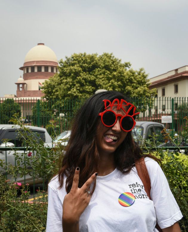 A girl poses outside the Supreme Court on Thursday.
