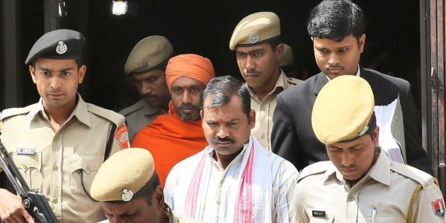 JAIPUR, INDIA - MARCH 16: The accused Devendra (Center) and Bhavesh Patel, convicted in the ajmer blast case.