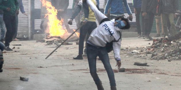 A file photo of demonstrators pelting stones during clashes in Jammu and Kashmir.