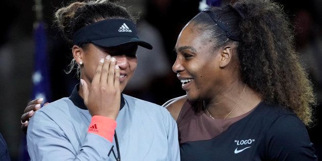 Naomi Osaka of Japan (left) cries as Serena Williams of the USA comforts her after the crowd booed during the trophy ceremony following the women's final on day thirteen of the 2018 U.S. Open.