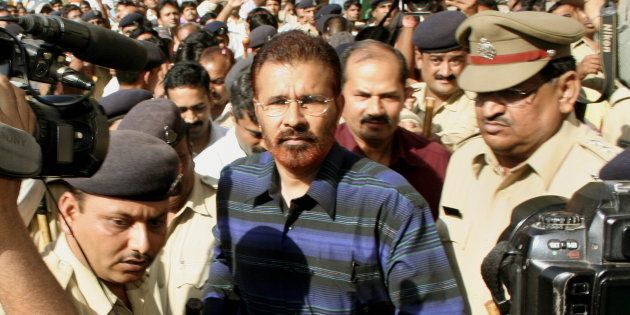 File photo -- DG Vanzara being escorted by the police following an appearance in the magistrates court in Ahmedabad, 01 May 2007.