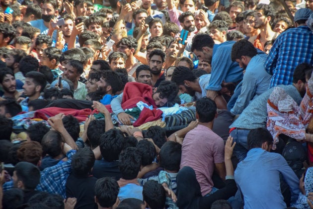 Mourners at the funeral of Altaf Ahmad Dar.