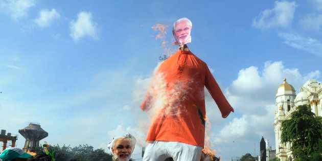 Trinamool Congress (TMC) members burned an effigy of Prime Minister Narendra Modi in a protest demonstration against price hike of petrol and diesel at Esplanade on September 10, 2018 in Kolkata, India. There were a series of interesting protests in Kerala.