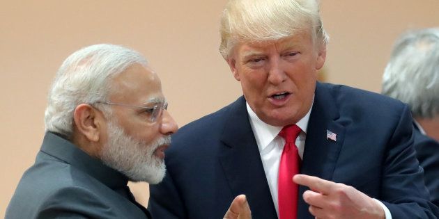 U.S. President Donald Trump chats with Prime Minister Narendra Modi during a working session at the G20 leaders summit in Hamburg, Germany July 8, 2017
