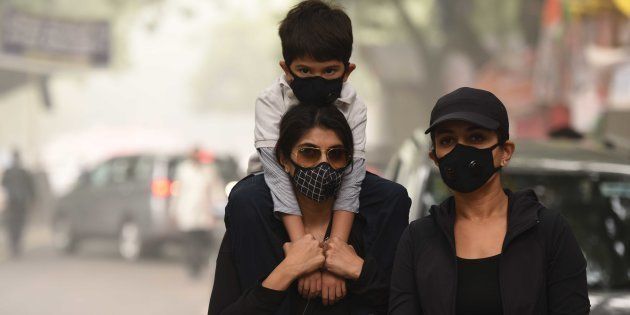 People wear pollution masks during the protest march for 'Your Right To Breathe' at Jantar Mantar, on November 6, 2016 in New Delhi, India.