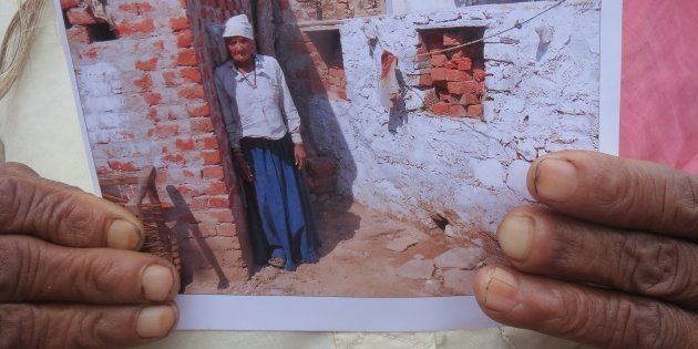 Angoori Khati of Jilota in Rajasthan, with the photo she had to show to claim Rs 12,000 reimbursement for building a latrine. She hasn't received it yet.