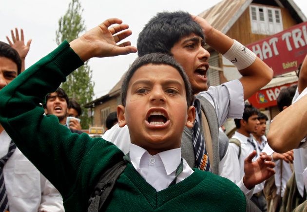 Kashmiri school children shout slogans against Indian security forces during a protest over the killing of Tufail Ahmad Matoo, in Srinagar in 2010.