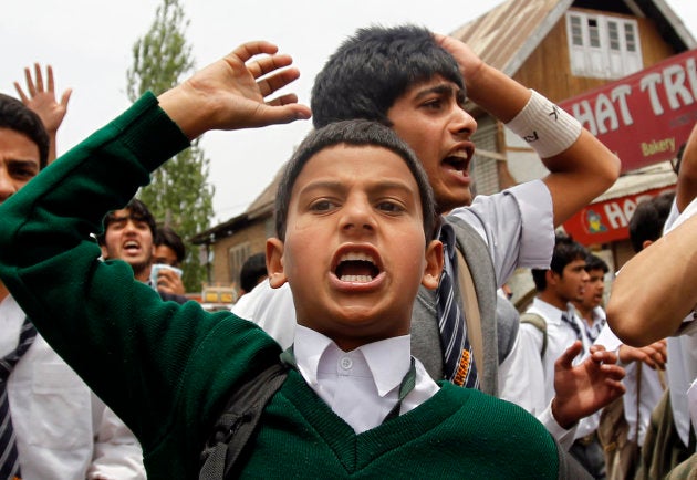 Kashmiri school children shout slogans against Indian security forces during a protest over the killing of Tufail Ahmad Matoo, in Srinagar in 2010.