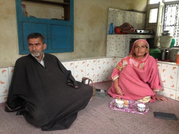 Naikoo's parents Asadullah and Zeba.