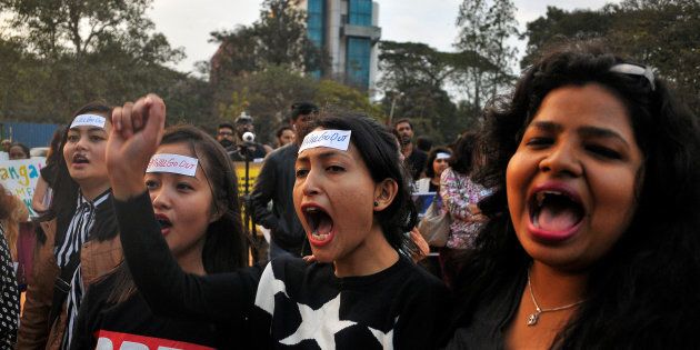 Women shout slogans as they take part in the #IWillGoOut rally, to show solidarity with the Women's March in Washington, along a street in Bengaluru, India, January 21, 2017. REUTERS/Abhishek N. Chinnappa