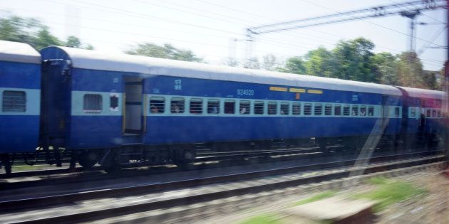 Indian Passenger Train moving alongside, Delhi, India