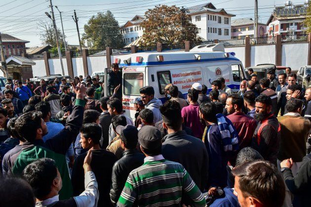 An ambulance carrying civilians injured in the explosion arrives at a hospital in Srinagar on Sunday.