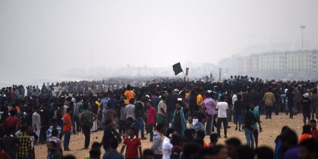 Indian police try to control a protest against the ban on the Jallikattu bull taming ritual at Marina Beach.