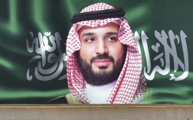 A picture taken on October 22, 2018 shows a man walking past a portrait of Saudi Crown Prince Mohammed bin Salman (MBS) in the capital Riyadh one day ahead of the Future Investment Initiative FII conference that will take place in Riyadh from 23-25 October. - Saudi Arabia will host a key investment summit overshadowed by the killing of critic Jamal Khashoggi that has prompted a wave of policymakers and corporate giants to withdraw. (Photo by FAYEZ NURELDINE / AFP) (Photo credit should read FAYEZ NURELDINE/AFP/Getty Images)