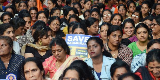 Women hold placards as they attend a protest rally called by various Hindu organisations against the lifting of ban by Supreme Court that allowed entry of women of menstruating age to the Sabarimala temple.