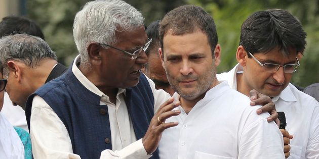 Communist Party of India's Rajya Sabha MP D. Raja, left, speaks with Congress party president Rahul Gandhi during the protest march towards the Central Bureau of Investigation (CBI) headquarters in New Delhi.