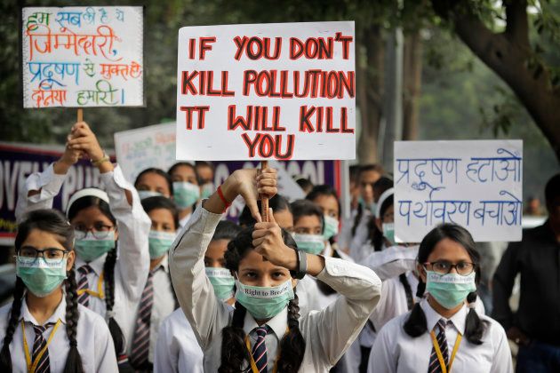 School children hold banners take out march to express their distress on the alarming levels of pollution in the city, in New Delhi, India, Wednesday, Nov. 15, 2017. Thick smog has constricted India's capital this week, smudging landmarks from view and leaving residents frustrated at the lack of meaningful action by authorities. The air was the worst it has been all year in New Delhi, with microscopic particles that can affect breathing and health spiking to 75 times the level considered safe by the World Health Organization. (AP Photo/Manish Swarup)