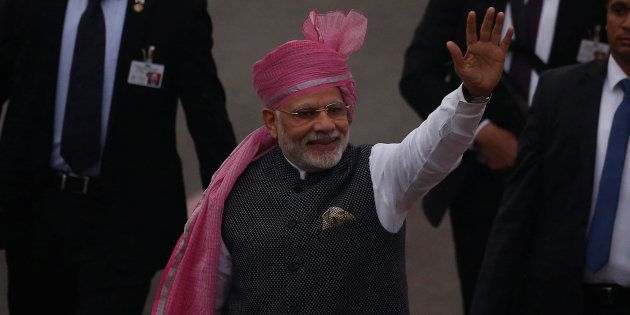PM Narendra Modi waves towards the crowd as he leaves after attending the Republic Day parade in New Delhi on 26 January 2017.