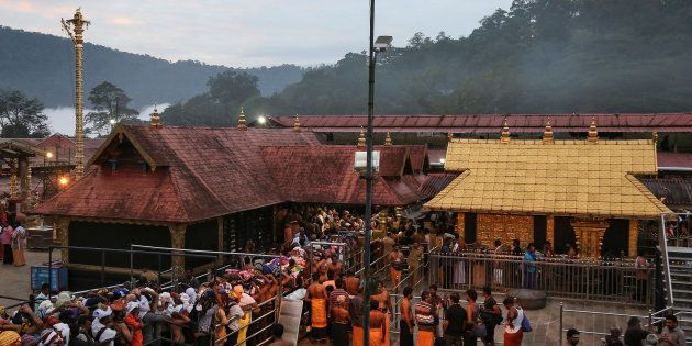 Hindu devotees wait in queues inside the premises of the Sabarimala temple in Pathanamthitta district in the southern state of Kerala, India, October 18, 2018. REUTERS/Sivaram V