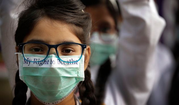 School children march to protest the alarming levels of pollution in New Delhi.