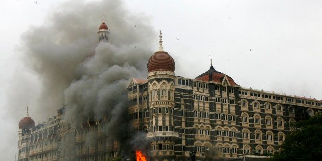 The Taj Mahal hotel is seen engulfed in smoke during the 2008 Mumbai attacks.
