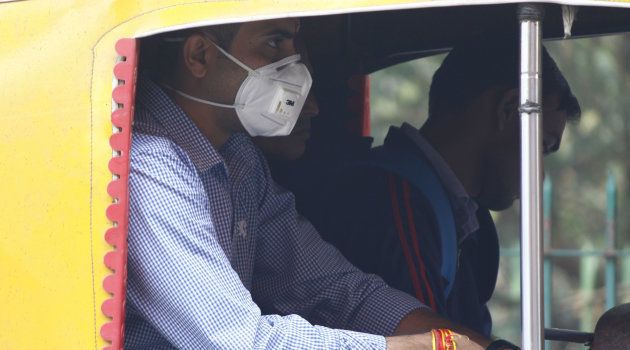 GURUGRAM, INDIA - NOVEMBER 9: A man wears an anti-air pollution mask as a protective gear amid heavy smog and air pollution levels, on November 9, 2018 in Gurugram, India. (Photo by Yogendra Kumar/Hindustan Times via Getty Images)