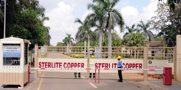 A private security guard stands in front of the main gate of Sterlite Industries Ltd's copper plant in Thoothukudi.