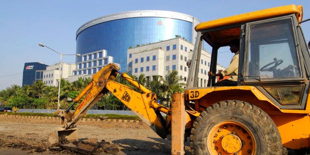 Road construction takes place near the IL&FS building, one of India's leading infrastructure-development and finance companies, in Mumbai, India, on Thursday, Nov. 29, 2007.