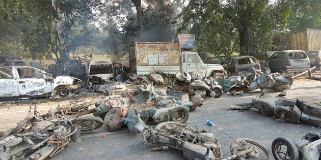 Smouldering vehicles seen following mob violence in Bulandhahr.