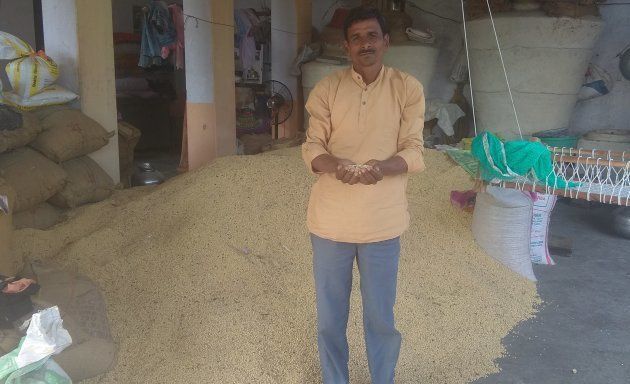 Gopal Dangi with a section of his Soyabean crop which survived, in a damaged form, after the late September 2018 rains.