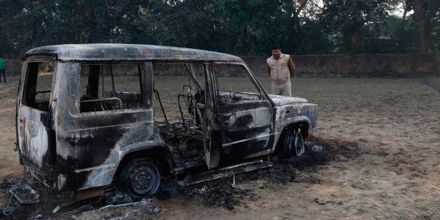 The vandalized remains of a car in which police Inspector Subodh Kumar Singh was fatally attacked, near a police station in Chingarwathi, near Bulandshahr