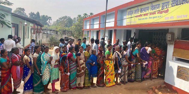 Voters line up to vote at a polling station in Chhattisgarh.