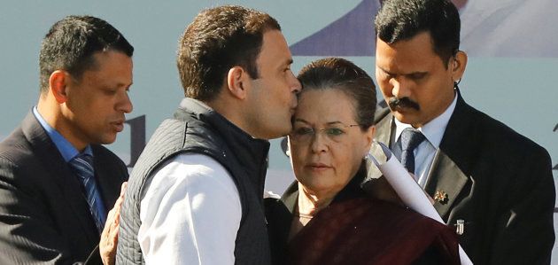 Rahul Gandhi, newly elected president of India's main opposition Congress party, kisses the forehead of his mother and leader of the party Sonia Gandhi after taking charge as the president during a ceremony at the party's headquarters in New Delhi, India, December 16, 2017. REUTERS/Altaf Hussain