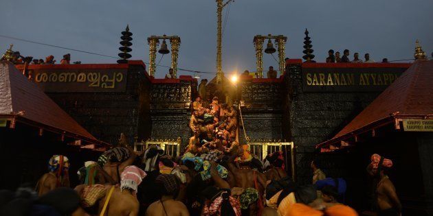 Devotees at a temple premises in Sabarimala.