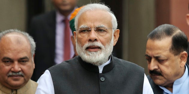 Prime Minister Narendra Modi arrives on the opening day of the winter session of the Parliament in New Delhi, India, Tuesday, Dec. 11, 2018.