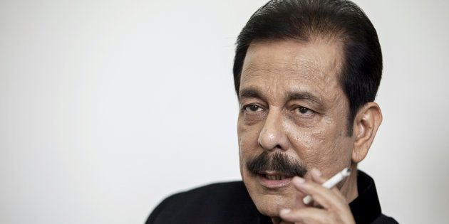Subrata Roy, chairman of Sahara Group, holds a cigarette as he speaks during an interview in Lucknow, India, on Monday, May 6, 2013. Roy's closely held Sahara India Pariwar group of companies includes real estate developers, insurers, media assets and sports teams. Photographer: Prashanth Vishwanathan/Bloomberg via Getty Images