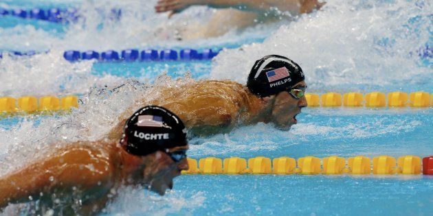 RIO DE JANEIRO, BRAZIL - AUGUST 10: Michael Phels of United States in action with Ryan Lochte of United States during the semifinal men's 200m individual medley at Olympic Aquatics Stadium on August 10, 2016 in Rio de Janeiro, Brazil. (Photo by Xavier Laine/Getty Images)