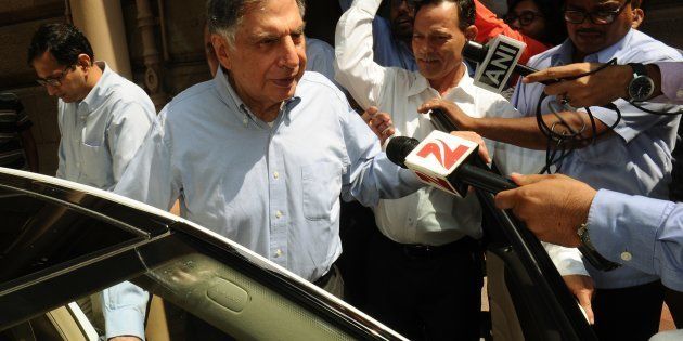 India's Tata Group's interim Chairman Ratan Tata (2nd L) leaves Bombay House