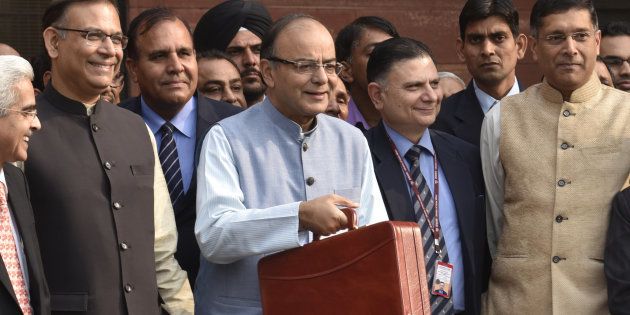 Union Finance Minister Arun Jaitley with Minister of State Jayant Sinha leaving Finance Ministry North Block to present the General Budget at Parliament House, on February 29, 2016 in New Delhi, India.